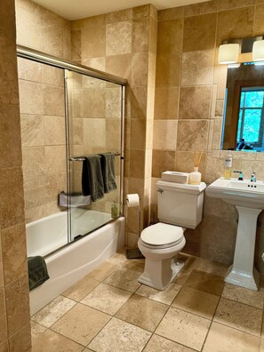 Shower, hair dryer, towels, soap