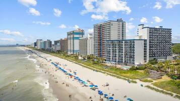 On the beach, sun-loungers