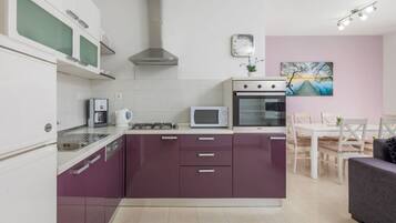 Villa | Private kitchen | Oven, electric kettle, toaster, highchair