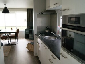 House | Private kitchen | Highchair - Cosy Holiday Home in Appelscha With a Great View (Appelscha)