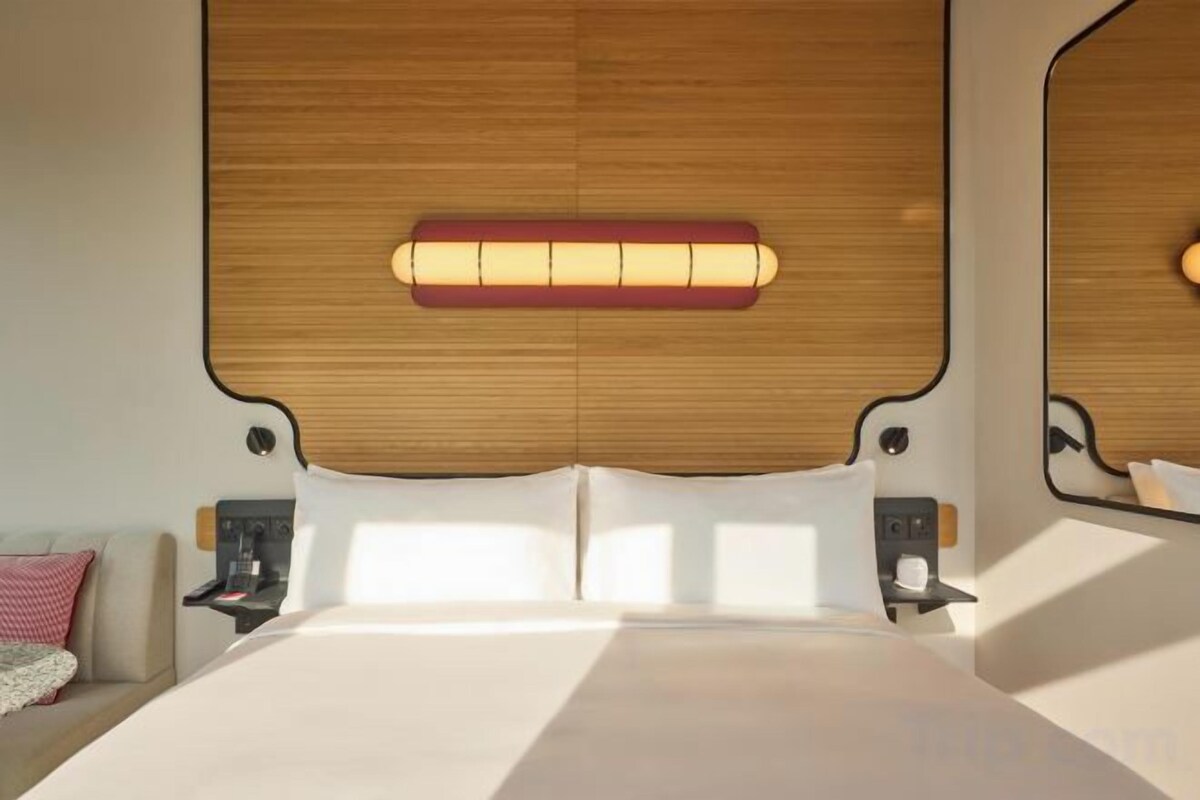 Luxe beddengoed, een minibar, een kluis op de kamer, een bureau