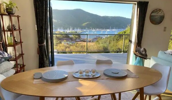 Enjoy a romantic meal with a scenic view of the marina and mountains from this dining area.