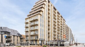 A multi-story hotel with balconies, a restaurant named 'Saltwaters', and a waterfront promenade. - Beautiful Apartment With Sea-view (Blankenberge)
