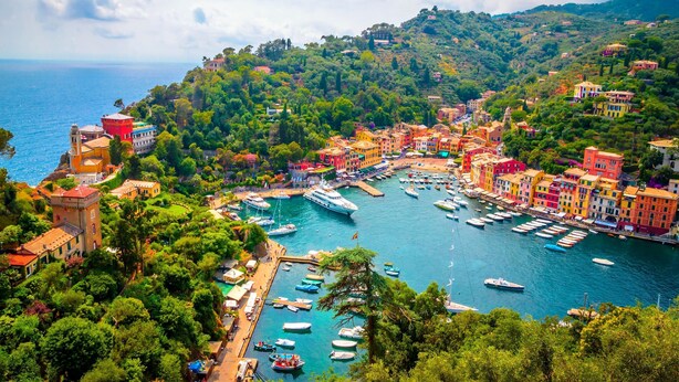 A coastal town with colorful buildings, a marina with boats, and lush greenery. - Cozy Maria Apartment in Portofino, Portofino, Italy (Portofino)
