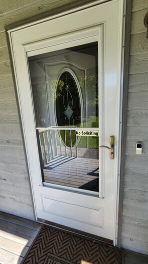 A white door with a glass panel and a "No Soliciting" sign. - Private 2 bed 2 bath house (Everett)