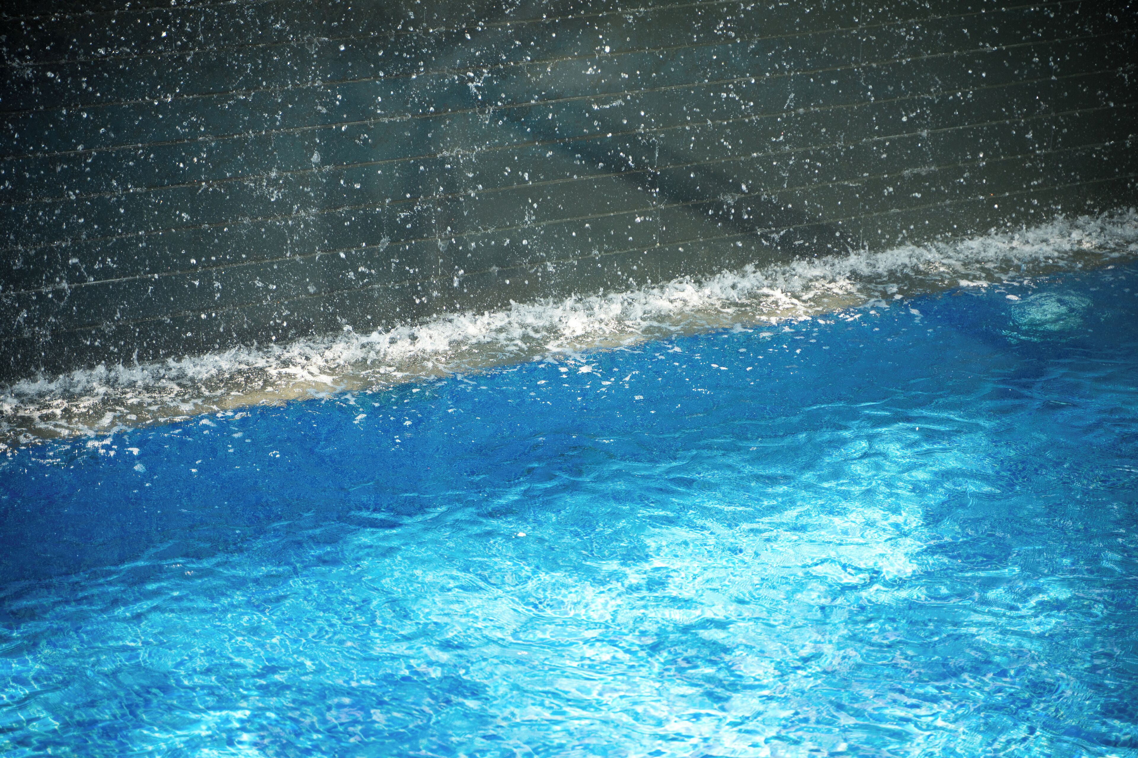 A pool with clear blue water and a visible edge.