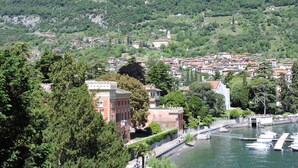 A coastal town with a marina, historic buildings, and lush green hills in the background. - Regina 29 by Interhome (Tremezzina)