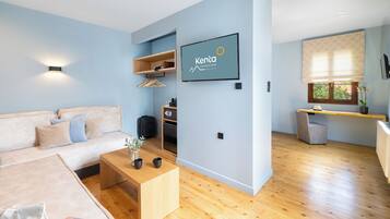 The Kenta Suite | Living area | 32-inch Smart TV with digital channels, Netflix, streaming services