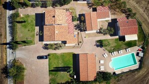 An aerial view of a residential area with multiple houses, a swimming pool, and a road. - Villa With Private Pool in Piancastagnaio (Piancastagnaio)