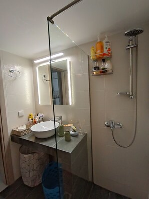 Shower, hair dryer, towels, soap