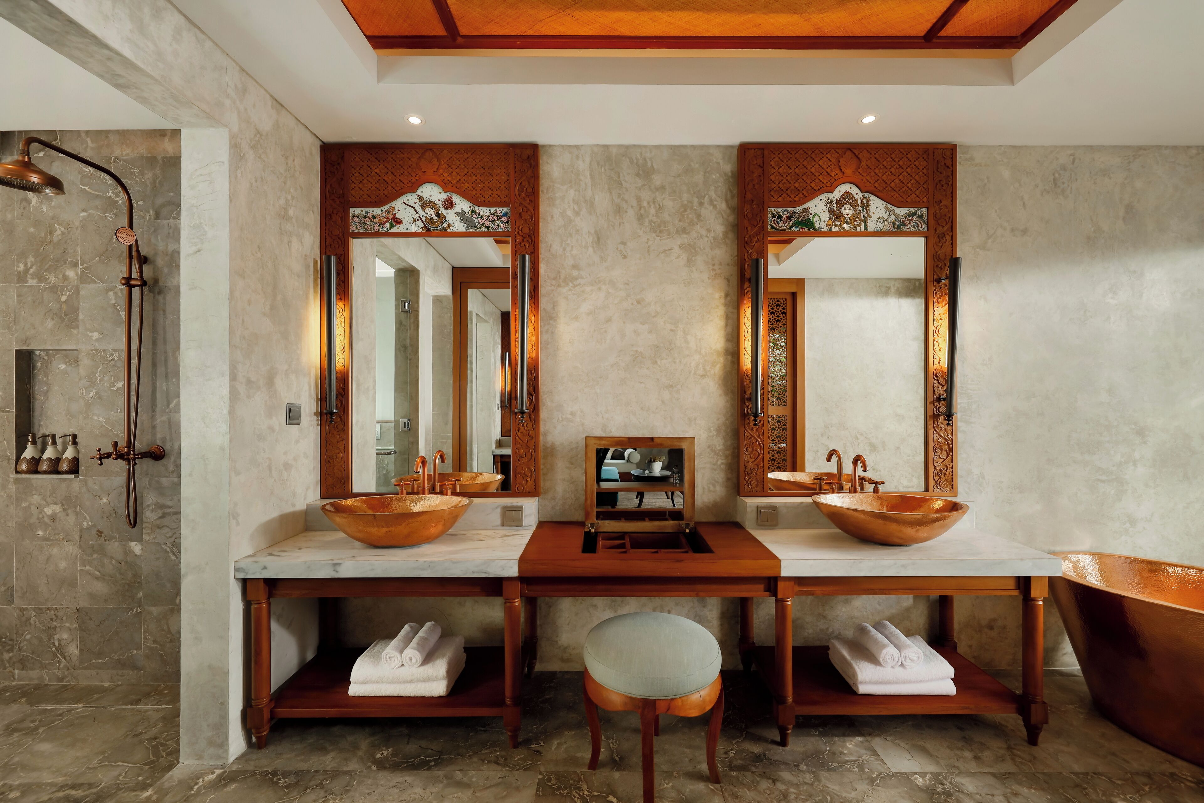 A bathroom with two sinks, a bathtub, and a shower.