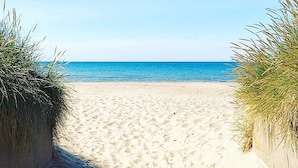 A sandy beach with clear blue water and a clear sky. - 4 Star Holiday Home in Skummeslovsstrand (Skummesloevsstrand)