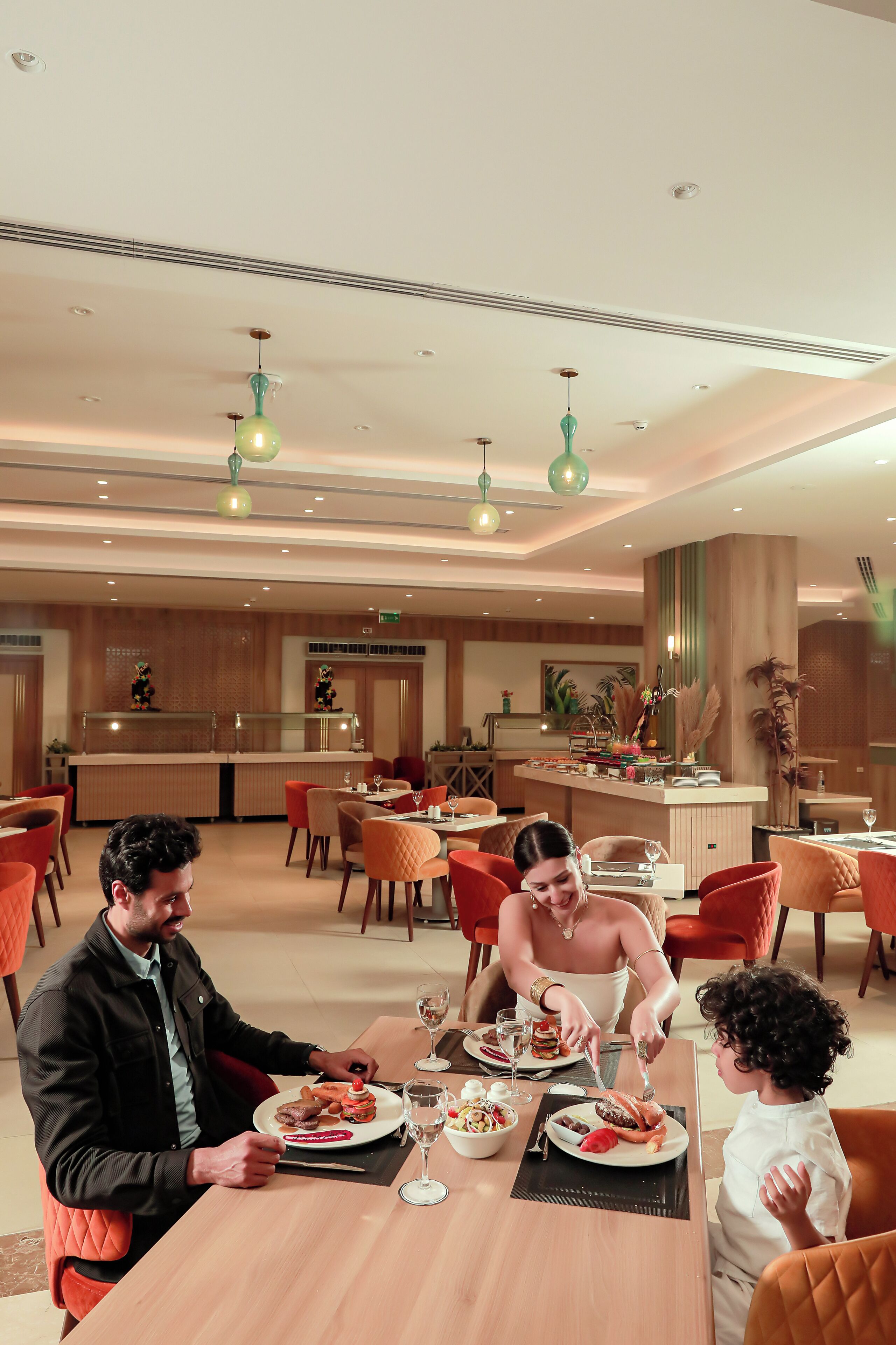 A dining area with tables, chairs, and a central counter.