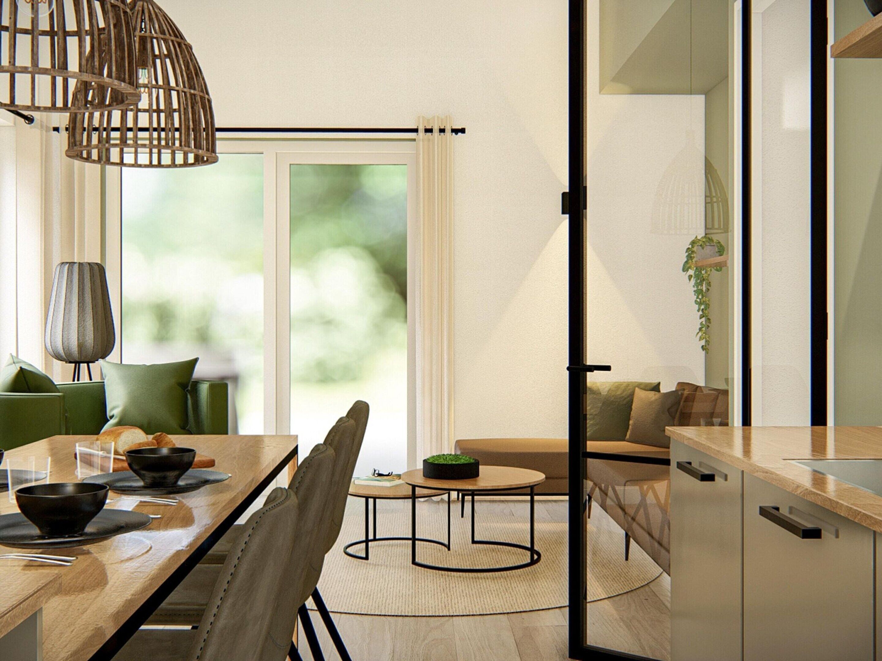 Un comedor moderno con una mesa de madera, sillas y una mesita redonda con un cuenco. Se ve un sofá y una planta al fondo.