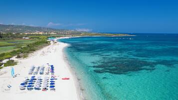 Private beach, white sand, sun loungers, beach umbrellas