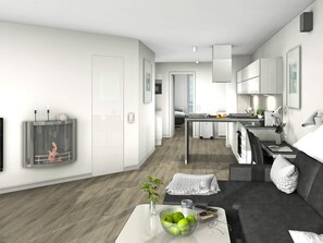 Un apartamento moderno con sala de estar, cocina y comedor. Hay un sofá, una mesa de centro con un tazón de manzanas y un televisor montado en la pared.