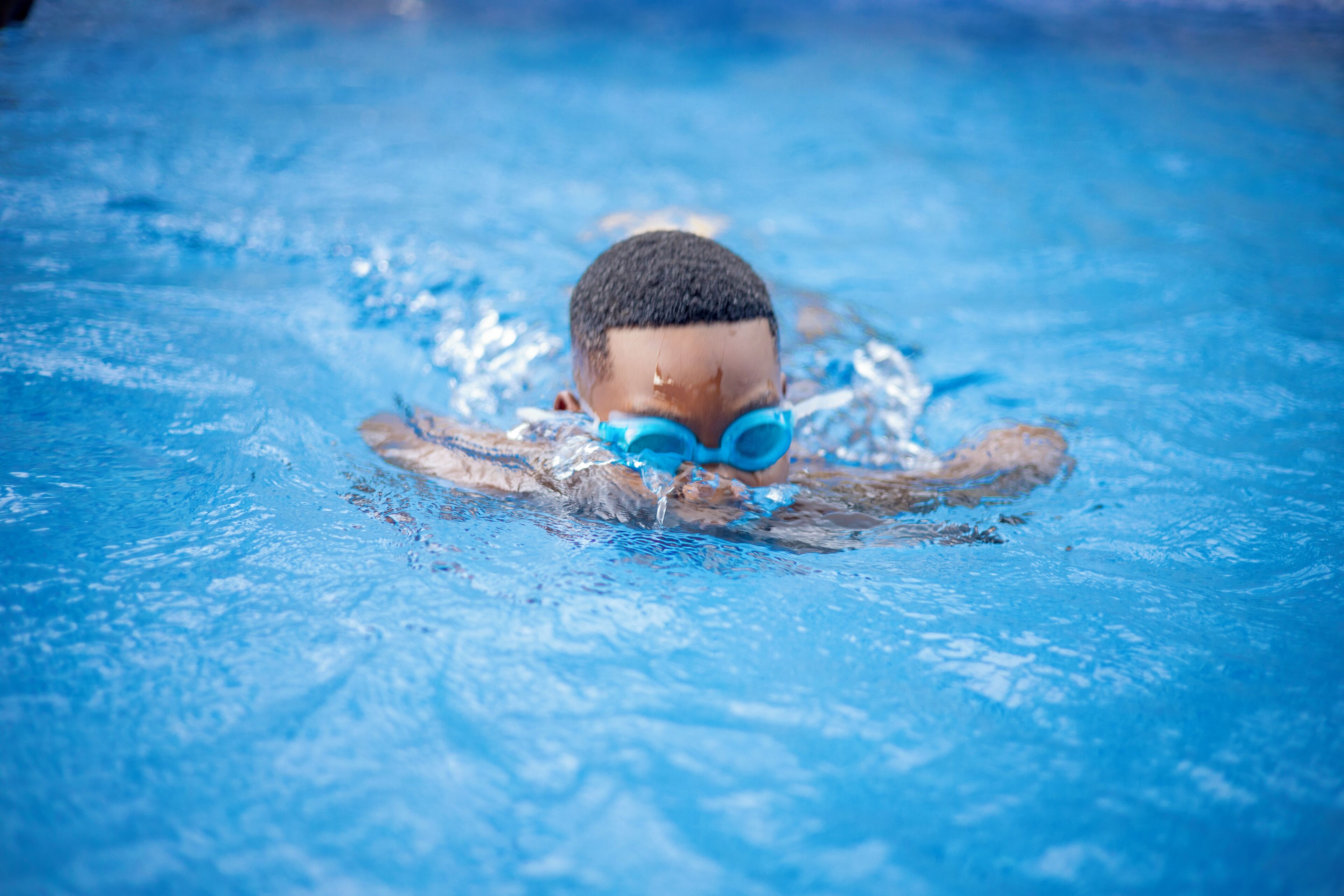A person swimming in a pool.
