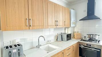 Apartment | Private kitchen | Fridge, microwave, oven, stovetop