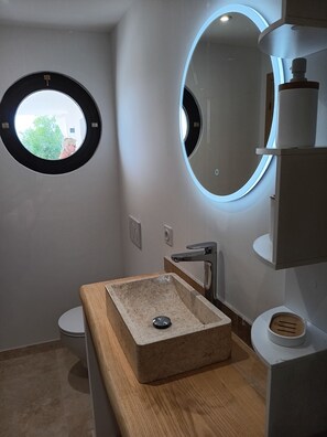 Shower, hair dryer, towels, toilet paper