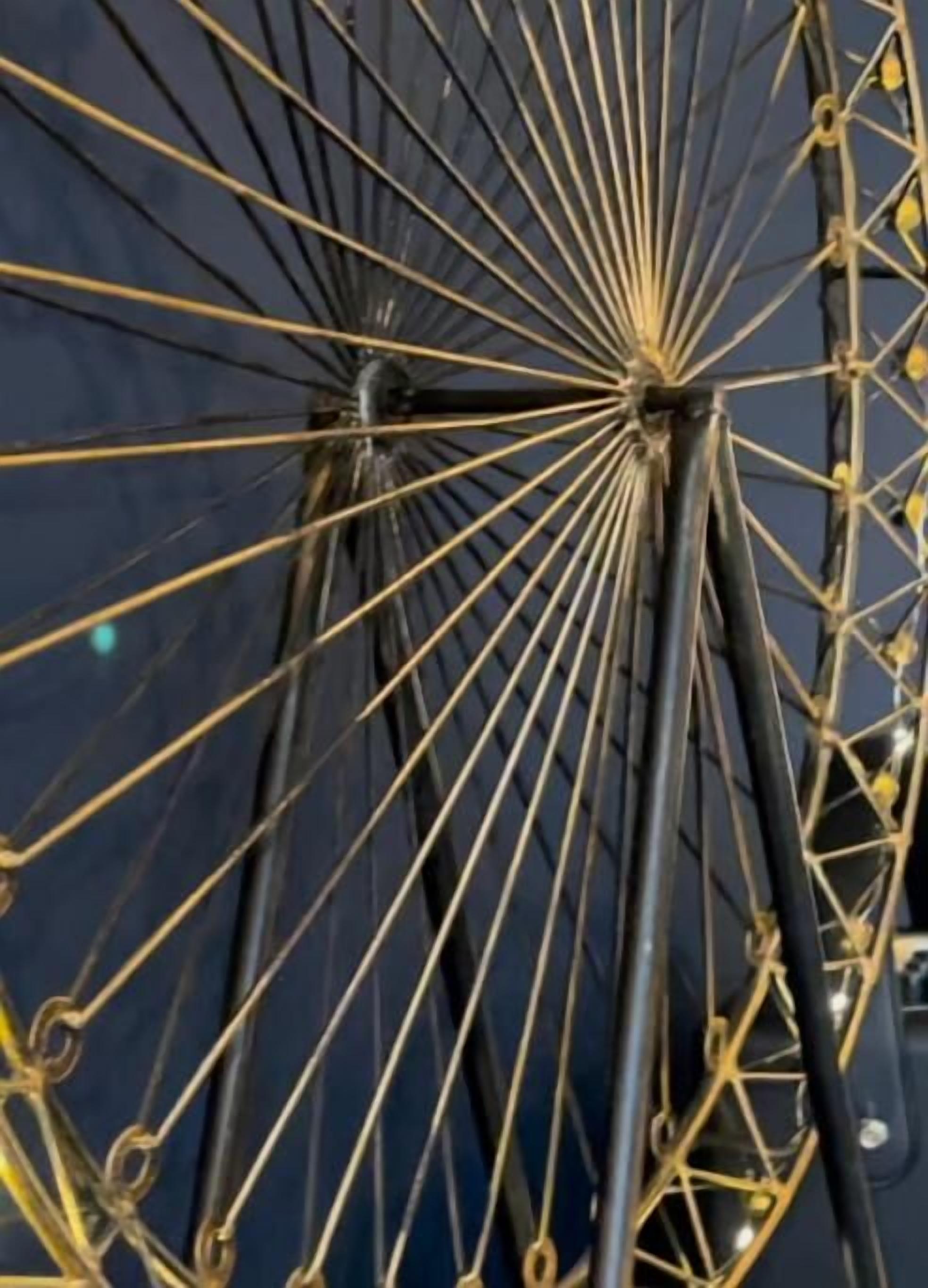 A close-up of a Ferris wheel's structure with spokes and cables.