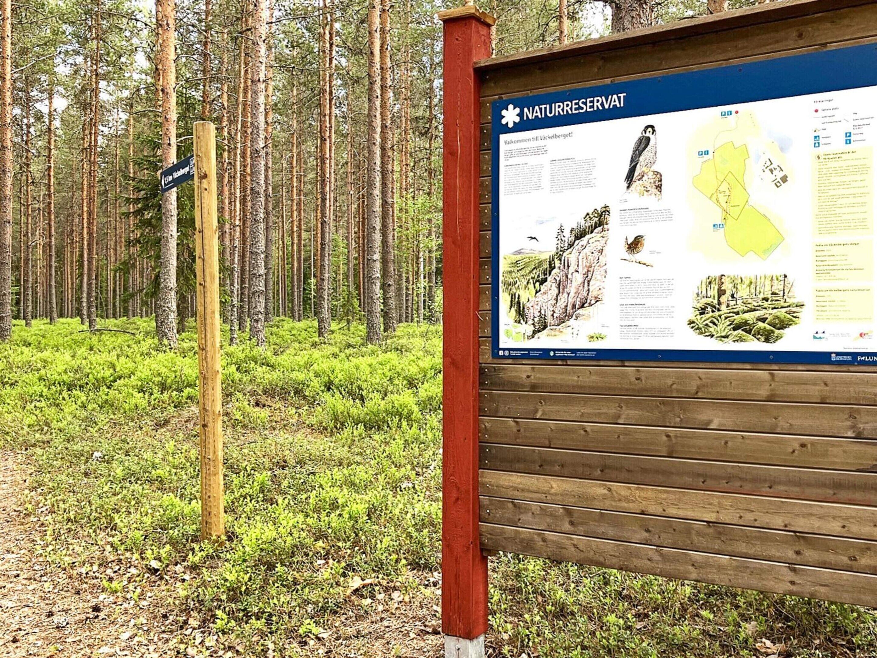A nature reserve sign with a map and information about local wildlife.