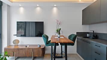 Executive Suite, Sea View | Living area | TV