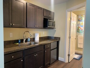 Fridge, microwave, coffee/tea maker, cookware/dishes/utensils