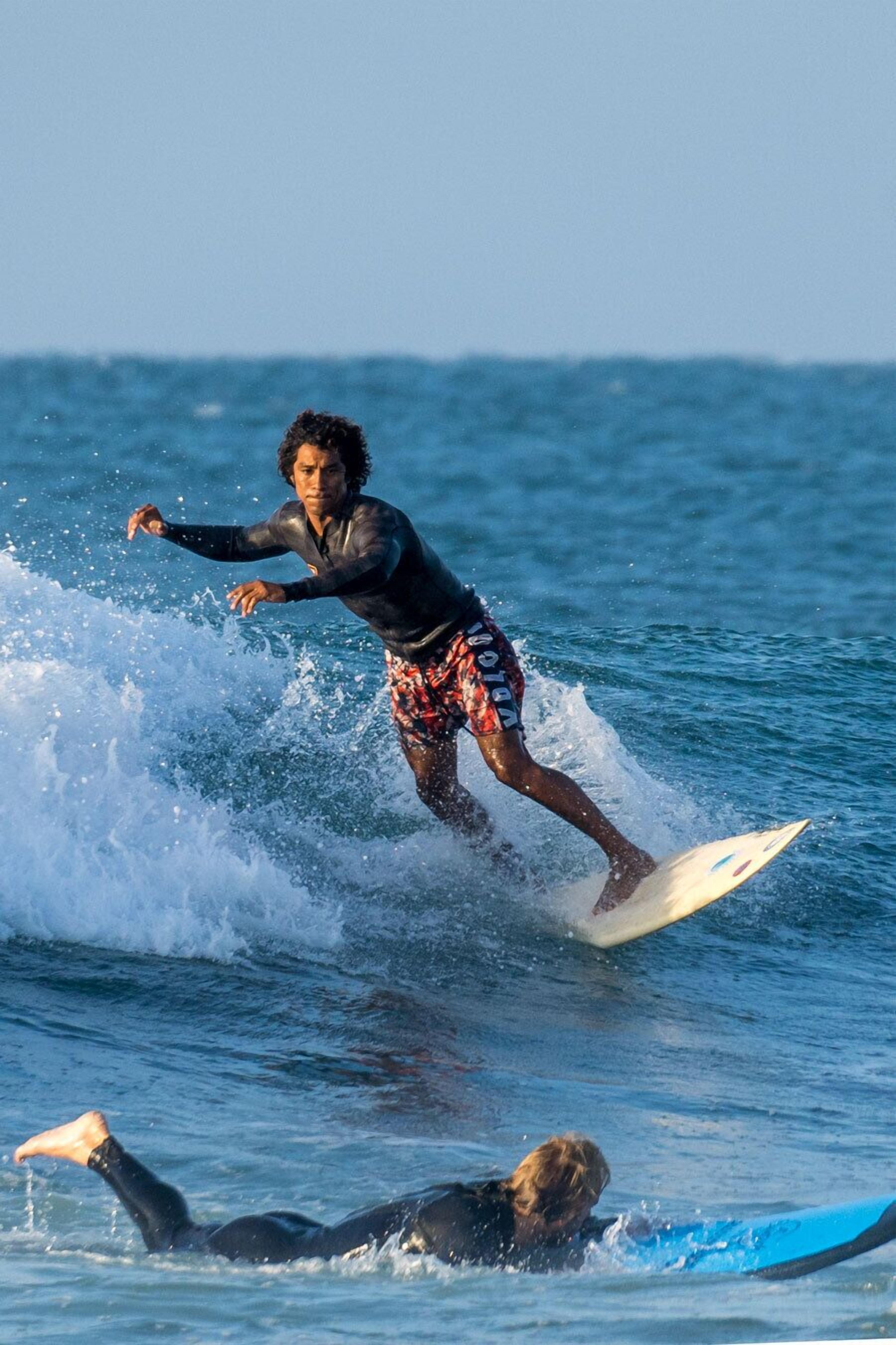 A surfer riding a wave.