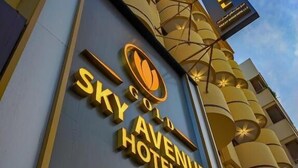 The exterior of the Gold Sky Avenue Hotel with its distinctive architectural design and signage. - Gold Sky Avenue Hotel (Dubai)
