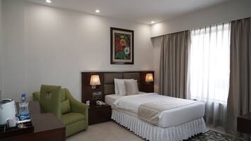 Deluxe Single Room | 1 bedroom, down comforters, pillowtop beds, in-room safe