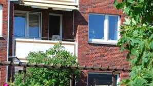 A two-story brick building with balconies and windows. - Near the Beach Modern Retreat (Wangerooge)