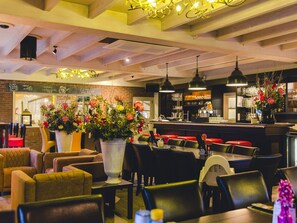 Enjoy a warm and inviting dining experience with a variety of seating options and a full-service bar.