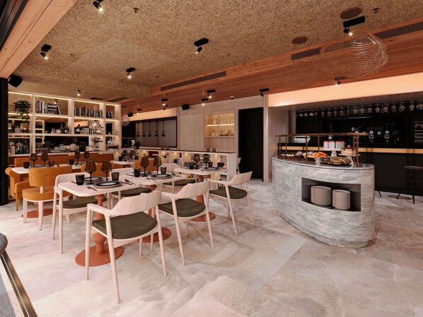 A modern interior with a bar area, seating, and bookshelves. - ibis Styles Lisboa Aeroporto (Loures)