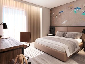 Una habitación de hotel moderna con una cama grande, un escritorio, una silla y una mesita de noche.