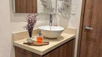 Shower, hair dryer, towels, soap