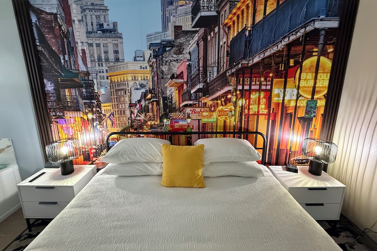Deluxe Room | 1 bedroom, down comforters, blackout drapes, iron/ironing board