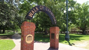 A brick archway with the inscription "WALK OF CHAMPIONS" and a plaque with a year "1848". - The Vault - Perfect Location! (Oxford)