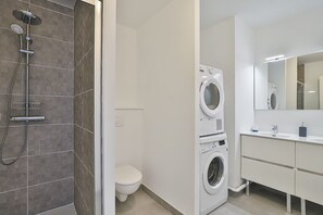 Shower, hair dryer, towels, soap