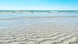 A beach with clear skies and gentle waves. - 4 Star Holiday Home in Bastad (Bastad)
