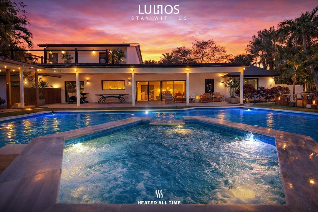 Nighttime vibes with a beautifully lit pool