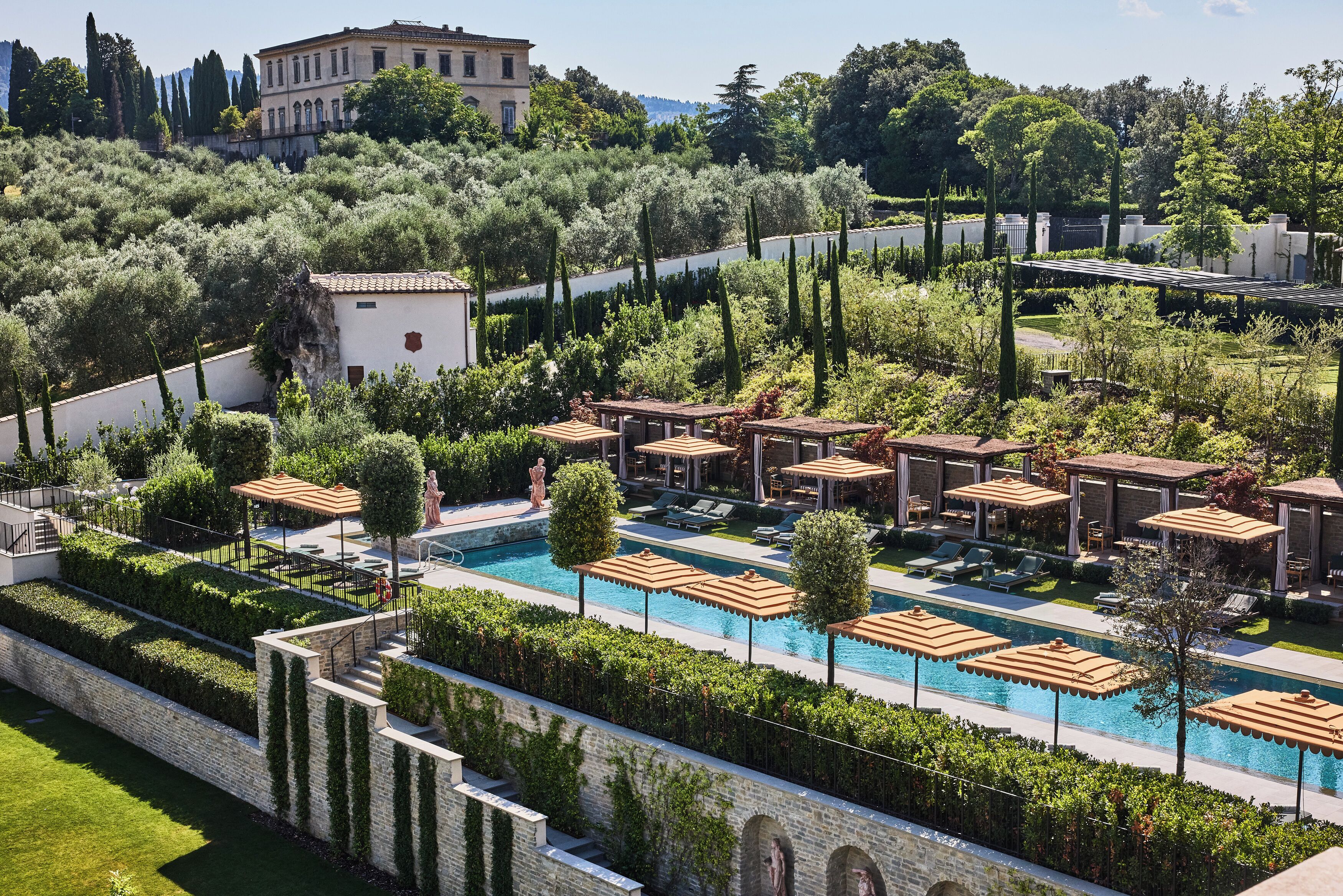 Seasonal outdoor pool, open 10:00 AM to 8:00 PM, pool umbrellas