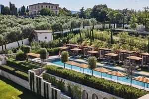Seasonal outdoor pool, open 10:00 AM to 8:00 PM, pool umbrellas