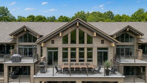 A multi-story building with a symmetrical facade, large windows, and balconies. - Tremblant Prestige - Verbier 12-203 (Mont-Tremblant)