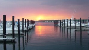 A marina with boats docked along the water during sunset. - SUMMER FUN IN A 3BED/2BATH SINGLE FAMILY HOME! (Belmar)