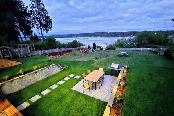 Scenic aerial view of our lush waterfront property, showcasing direct beach A