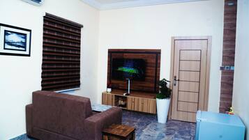 Luxury Studio, Kitchenette | Living area | Smart TV