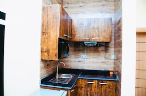 Apartamento superluxo, 1 quarto, para não fumantes, cozinha americana | Cozinha americana privada | Frigobar, micro-ondas