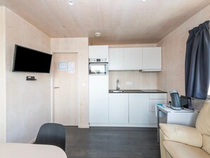 Apartment | Private kitchen | Microwave, electric kettle, high chair