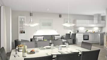 Un comedor moderno con una mesa blanca dispuesta para cuatro personas, rodeada de sillas oscuras.