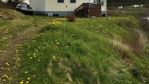 A single-story house with a front deck and a garage.